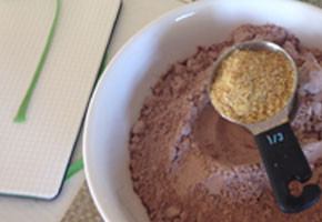 a measuring cup of flax with some brownie mix