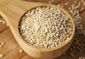 Quinoa on a wooden spoon