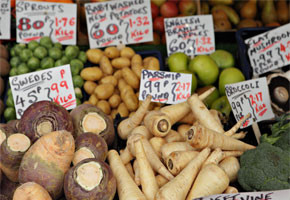 A farm stand featuring late harvest veggies such as rutabaga, parsnip and broccoli